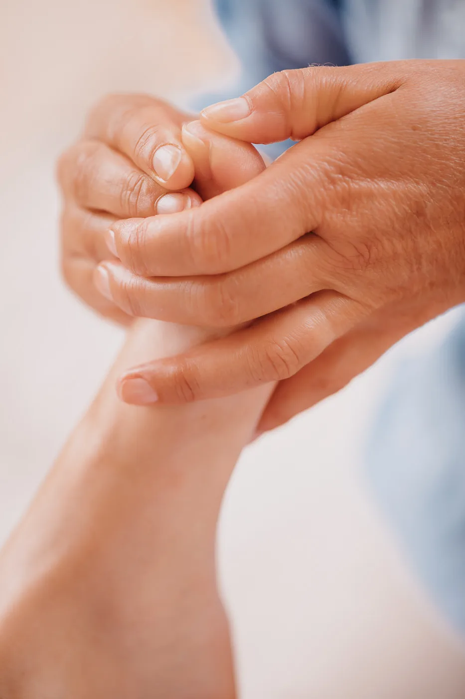 Hands working on a foot